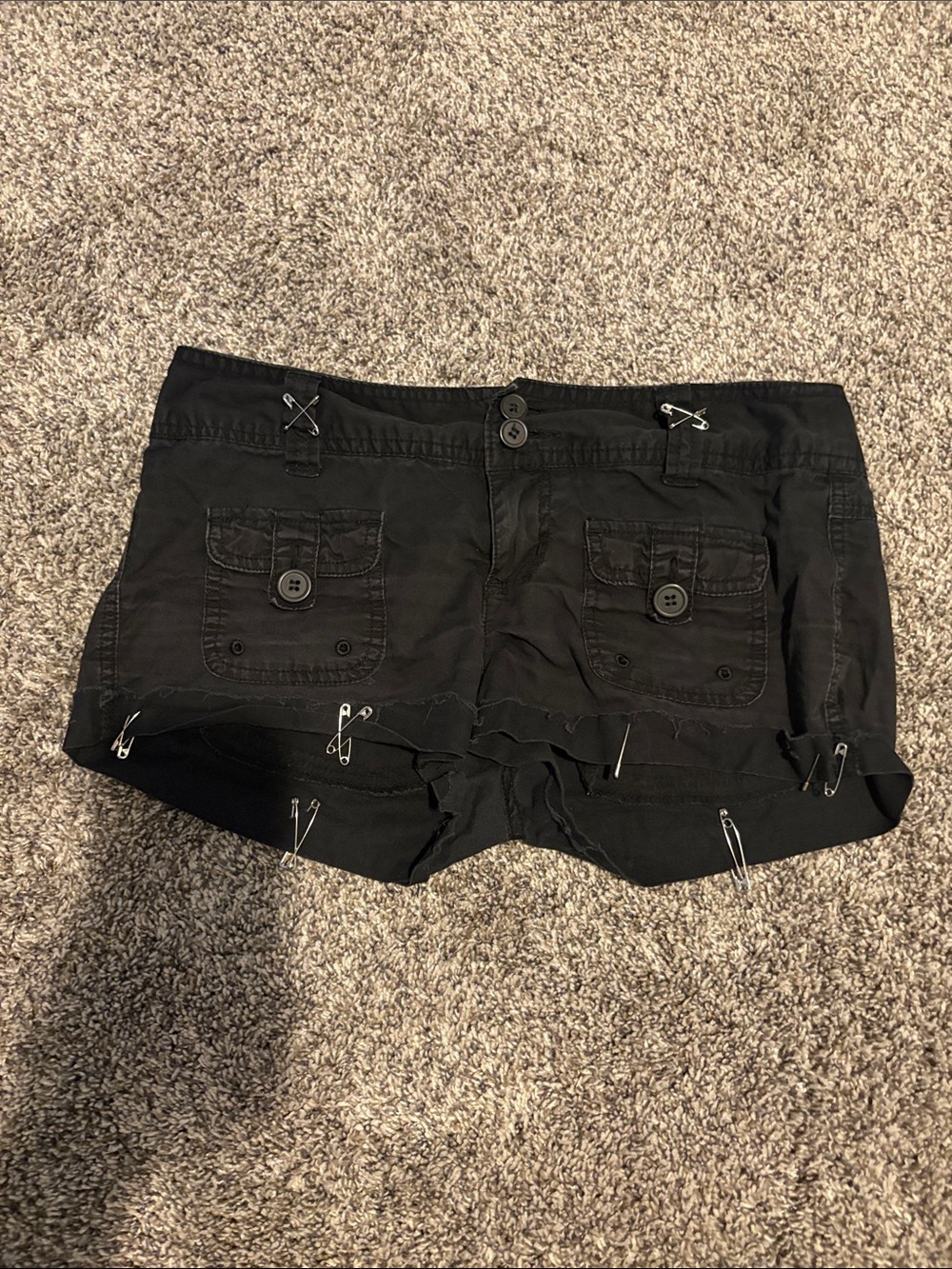 Black goth inspired shorts with silver safety pins and zipper details